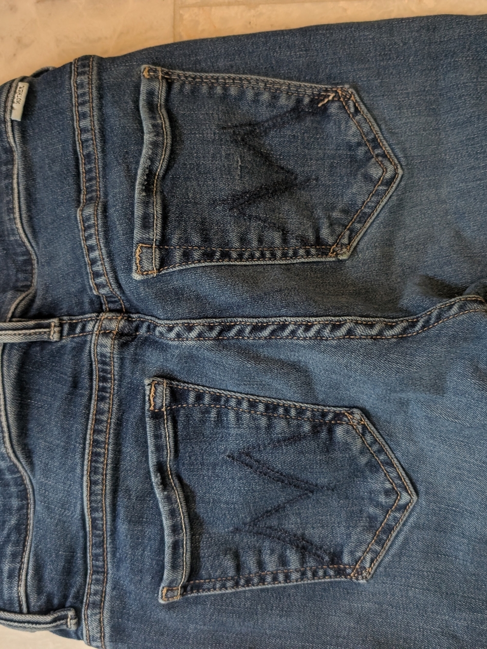 MOTHER Straight Leg Jeans in Mid Blue Wash - women's Size 24